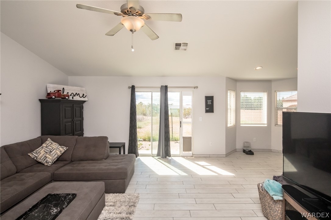 2080 Jamie Road Fort Mohave, AZ 86426 - Photo 10 of 29 a living room with furniture and a flat screen tv