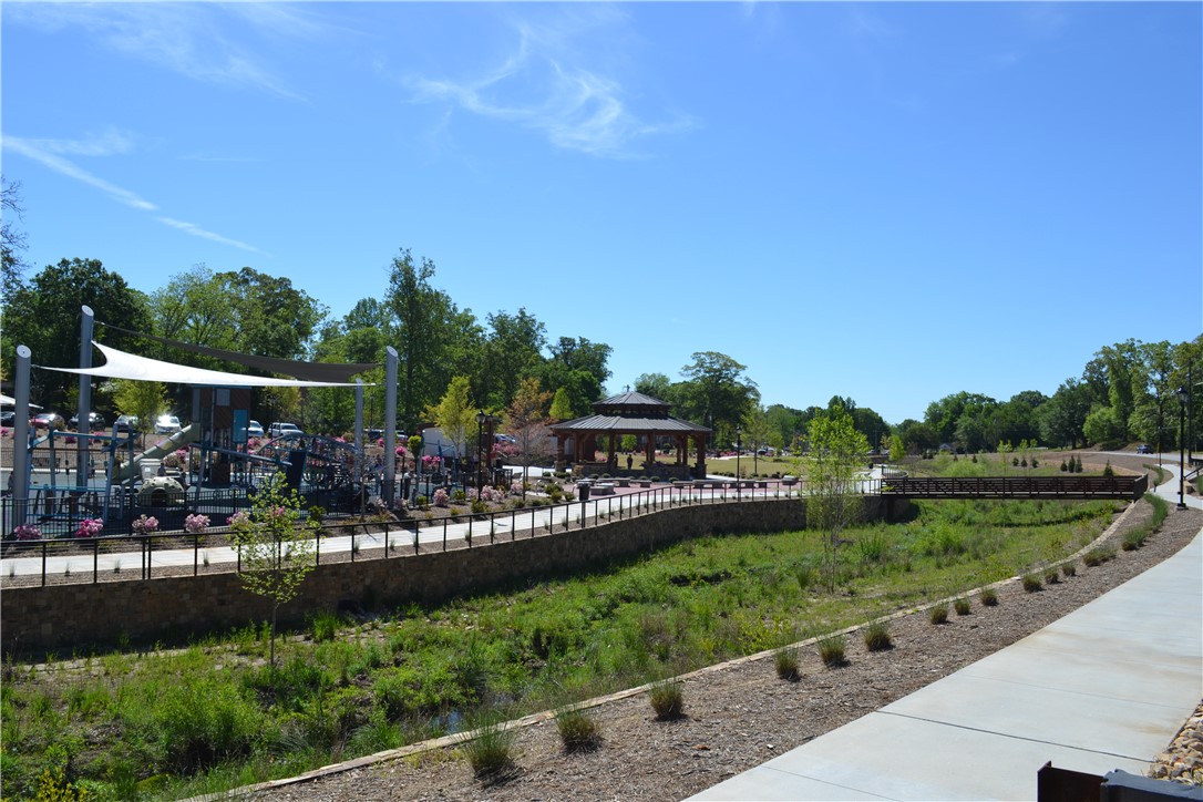 205 B East Broad Street Anderson, SC 29621 - Photo 16 of 27 Linley park offers recreational spaces and lush greenery under a clear sky.