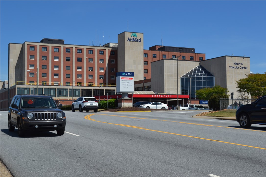 205 B East Broad Street Anderson, SC 29621 - Photo 24 of 27 This structure features an emergency entrance and multi-story facade under clear skies.