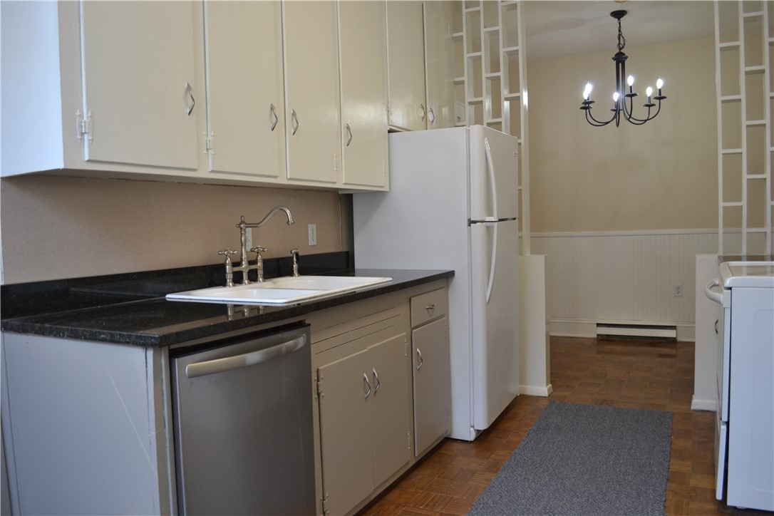 205 B East Broad Street Anderson, SC 29621 - Photo 3 of 27 This functional kitchen features ample cabinetry and a connected dining area, perfect for everyday living.