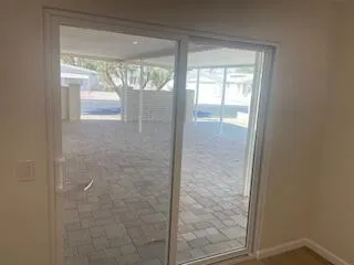 a bathroom with a glass shower door