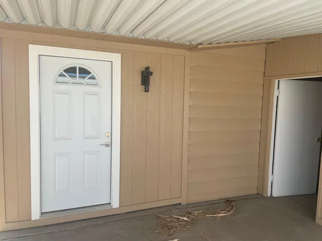 a view of a hallway with closet area