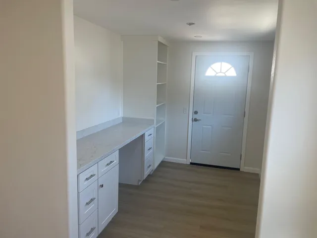 a view of cabinets and wooden floor