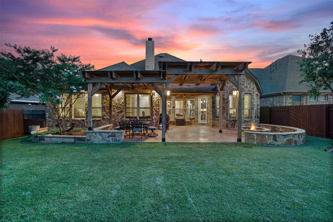 4499 Miraval Loop Round Rock, TX 78665 - Photo 1 of 1 a view of a chair and table of the house in the back yard