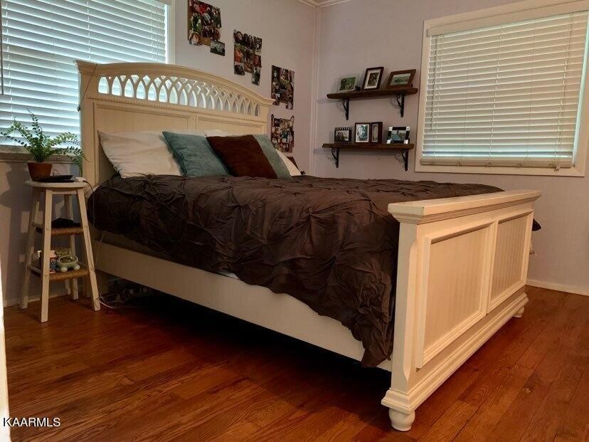 100 Oxford Road Oak Ridge, TN 37830 - Photo 8 of 11 a bedroom with a bed and a window