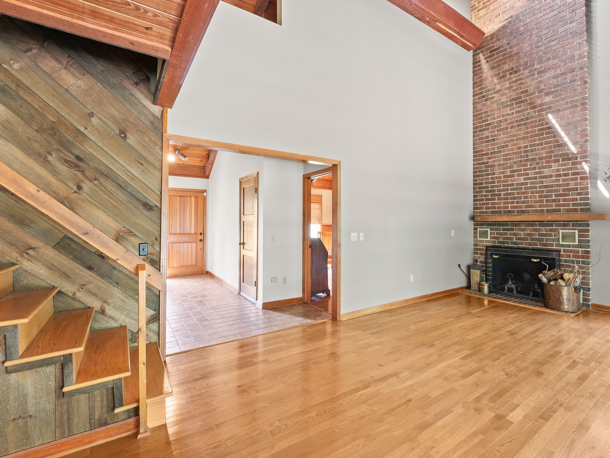 144 Wood Bluff Road Winchester, TN 37398 - Photo 11 of 63 a view of an empty room with wooden floor and a fireplace