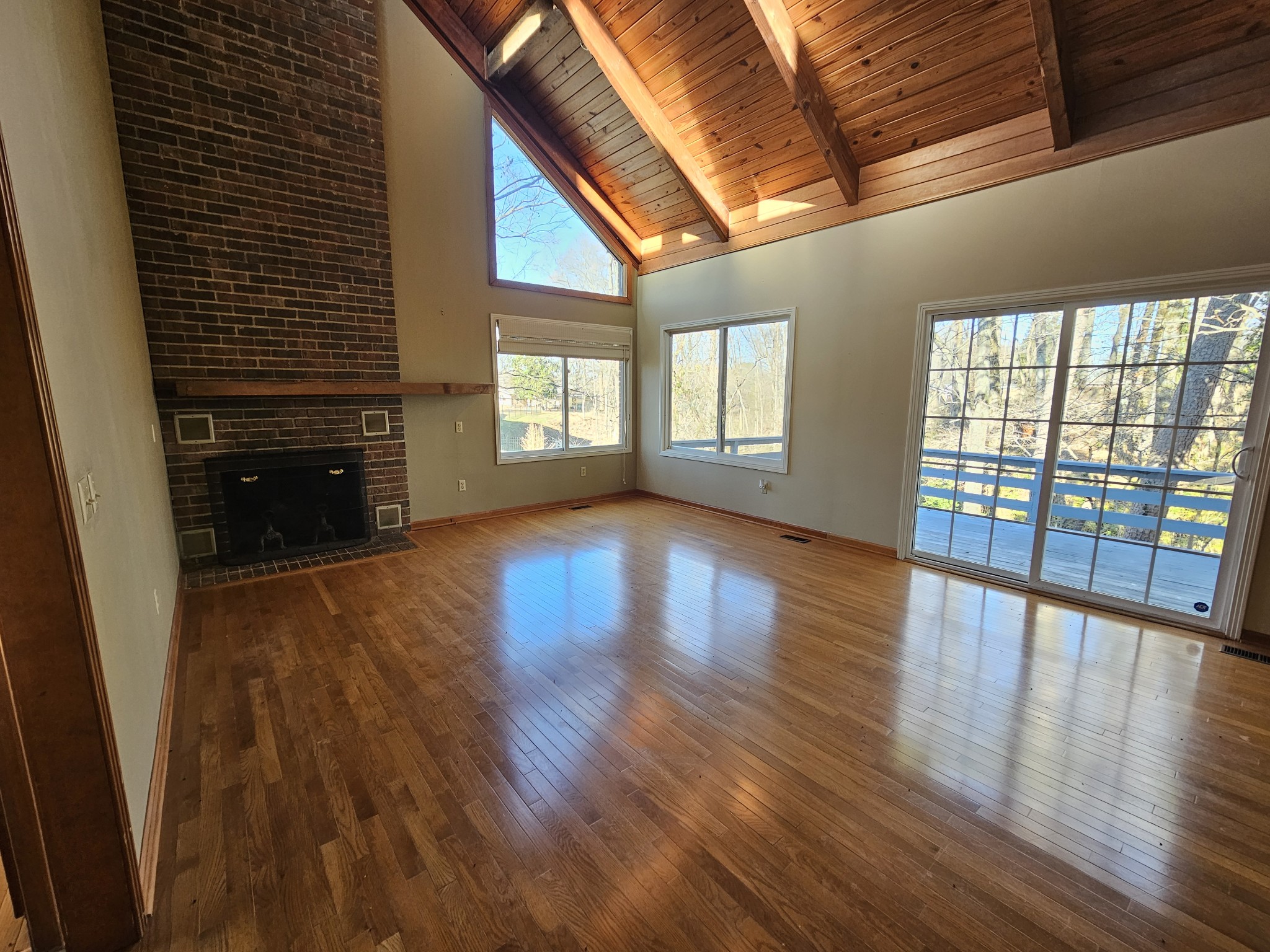 144 Wood Bluff Road Winchester, TN 37398 - Photo 16 of 63 a view of an empty room with wooden floor and a window