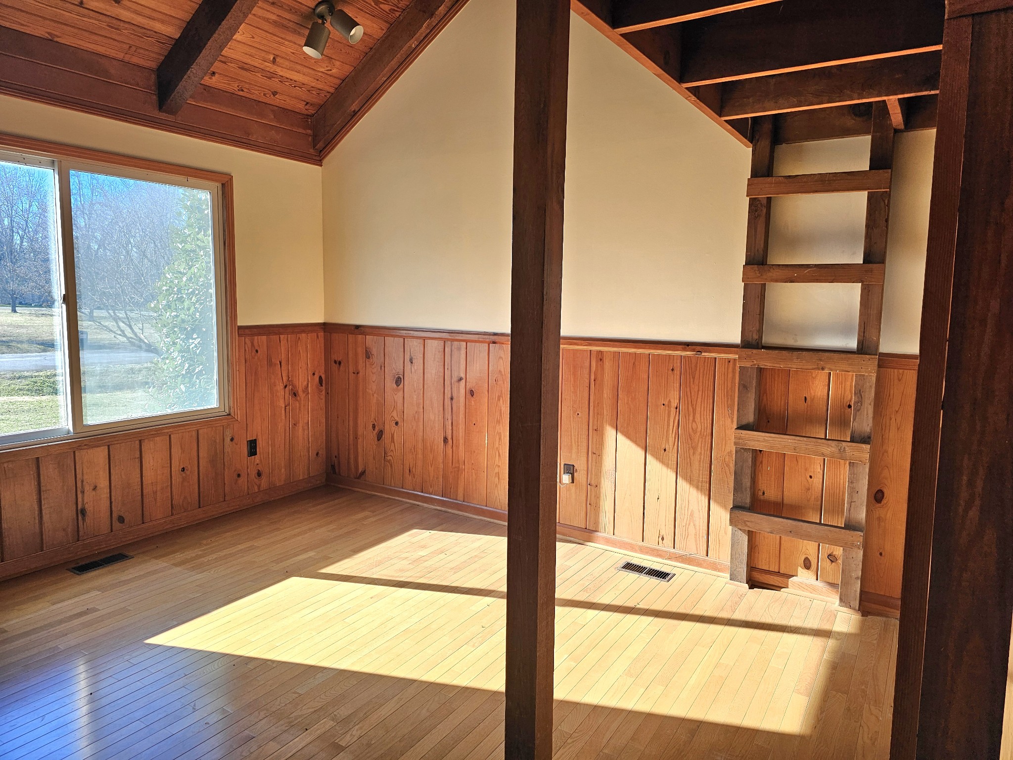 144 Wood Bluff Road Winchester, TN 37398 - Photo 24 of 63 a view of a door with wooden floor and windows