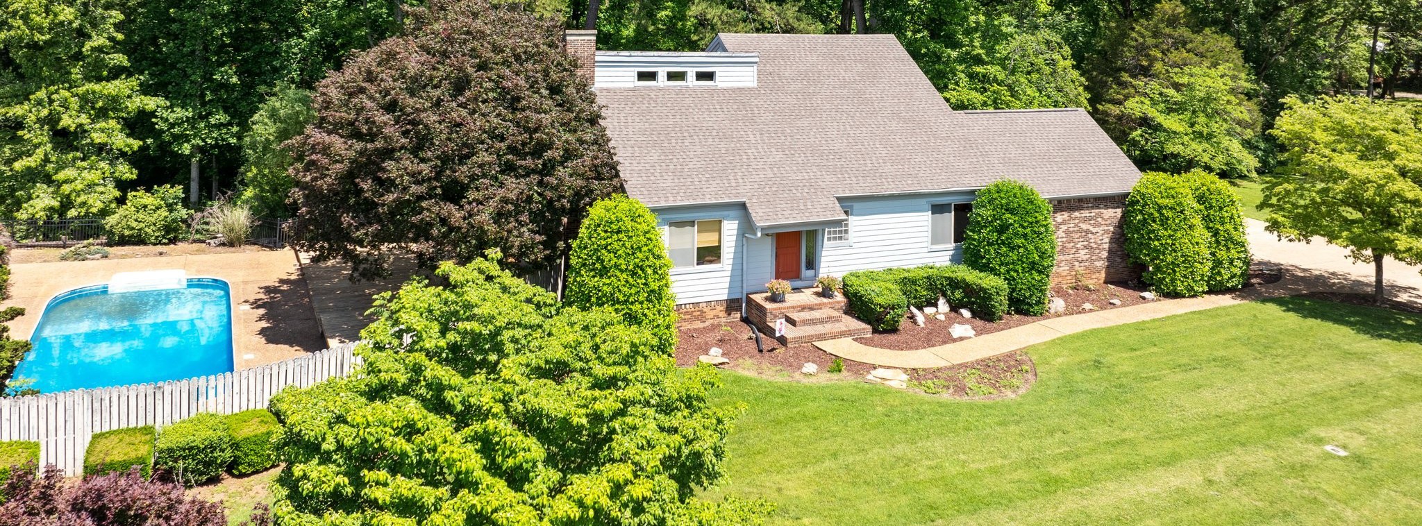 144 Wood Bluff Road Winchester, TN 37398 - Photo 3 of 63 a view of a house with a yard and a garden
