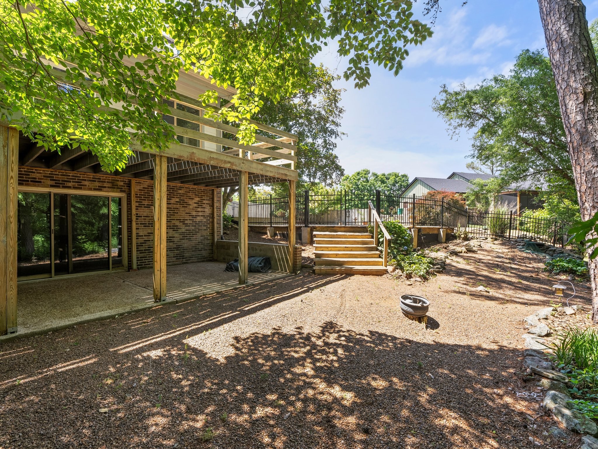144 Wood Bluff Road Winchester, TN 37398 - Photo 60 of 63 a view of a backyard with floor to ceiling window and tree