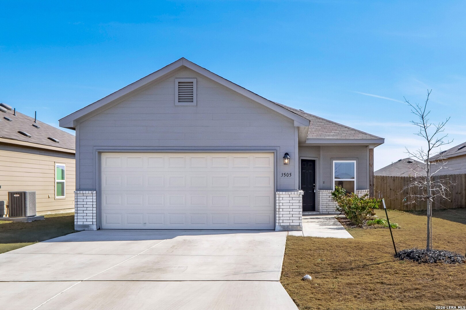 a front view of a house with garage