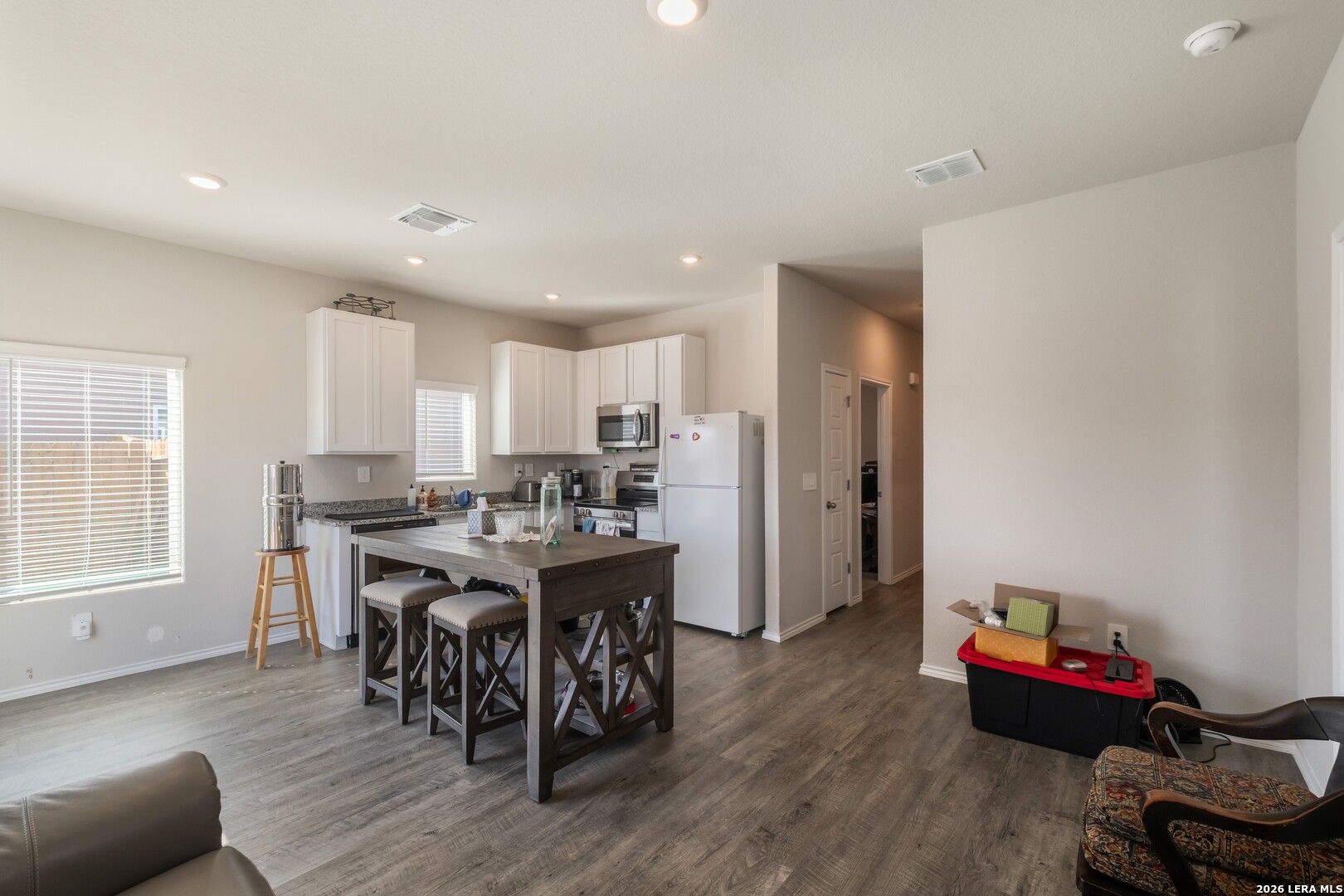 3505 Sky Place Seguin, TX 78155 - Photo 12 of 30 a view of a dining room with furniture and wooden floor