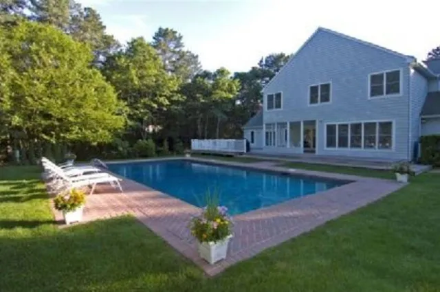 a view of a house with swimming pool