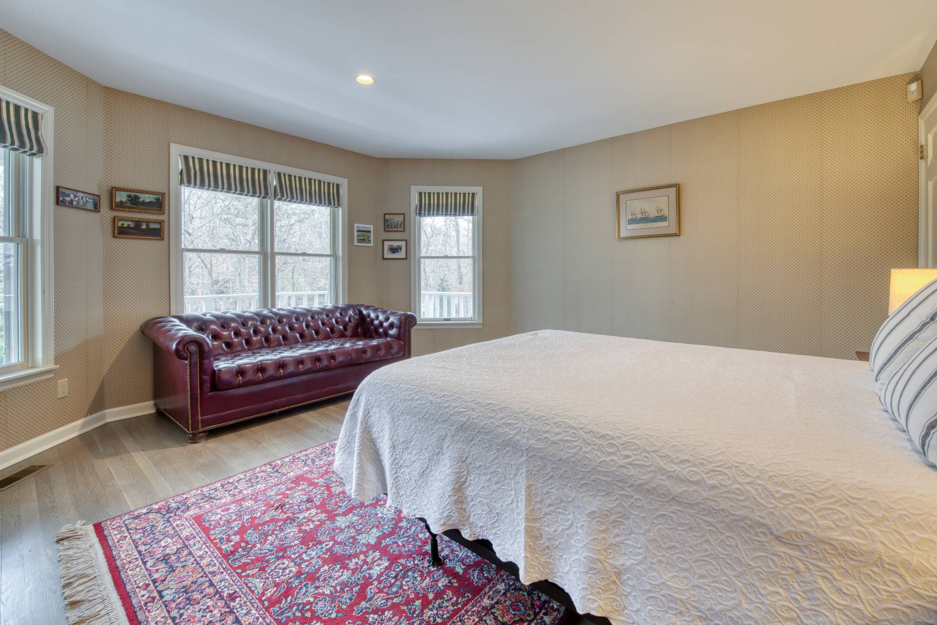 1611 Deerfield Road Water Mill, NY 11976 - Photo 14 of 22 a bedroom with a bed and a couch