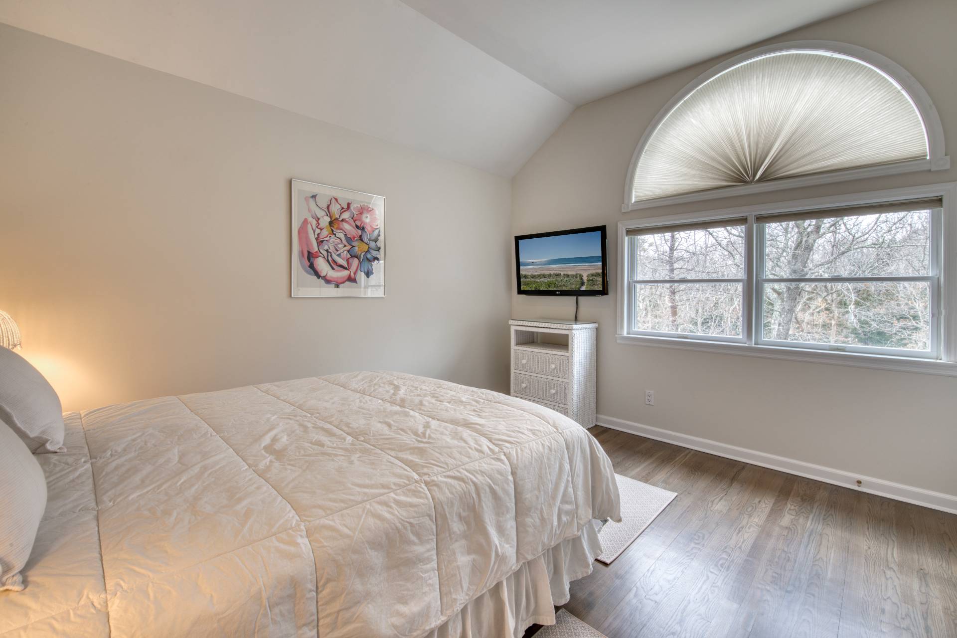 1611 Deerfield Road Water Mill, NY 11976 - Photo 21 of 22 a bedroom with a bed and a large window