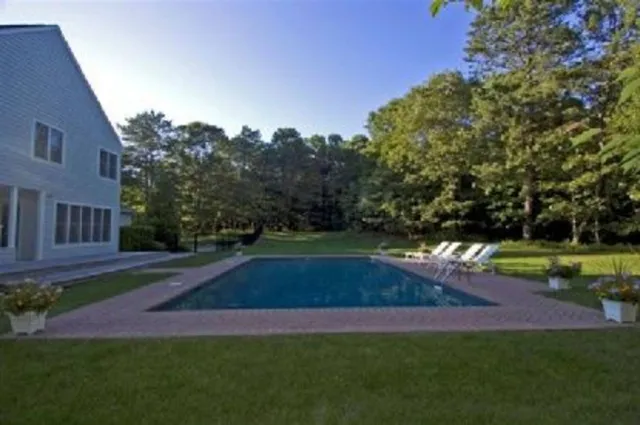 a view of backyard with green space