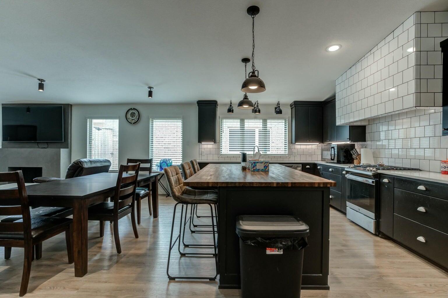 3711 128th Street Lubbock, TX 79423 - Photo 11 of 42 a kitchen with a counter space a sink appliances and cabinets