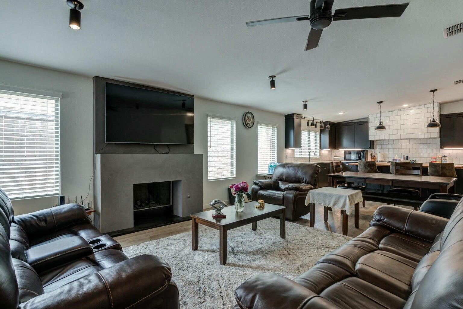 3711 128th Street Lubbock, TX 79423 - Photo 15 of 42 a living room with furniture and a fireplace