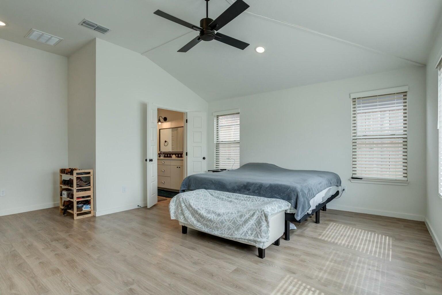 3711 128th Street Lubbock, TX 79423 - Photo 20 of 42 a bedroom with a bed and a desk