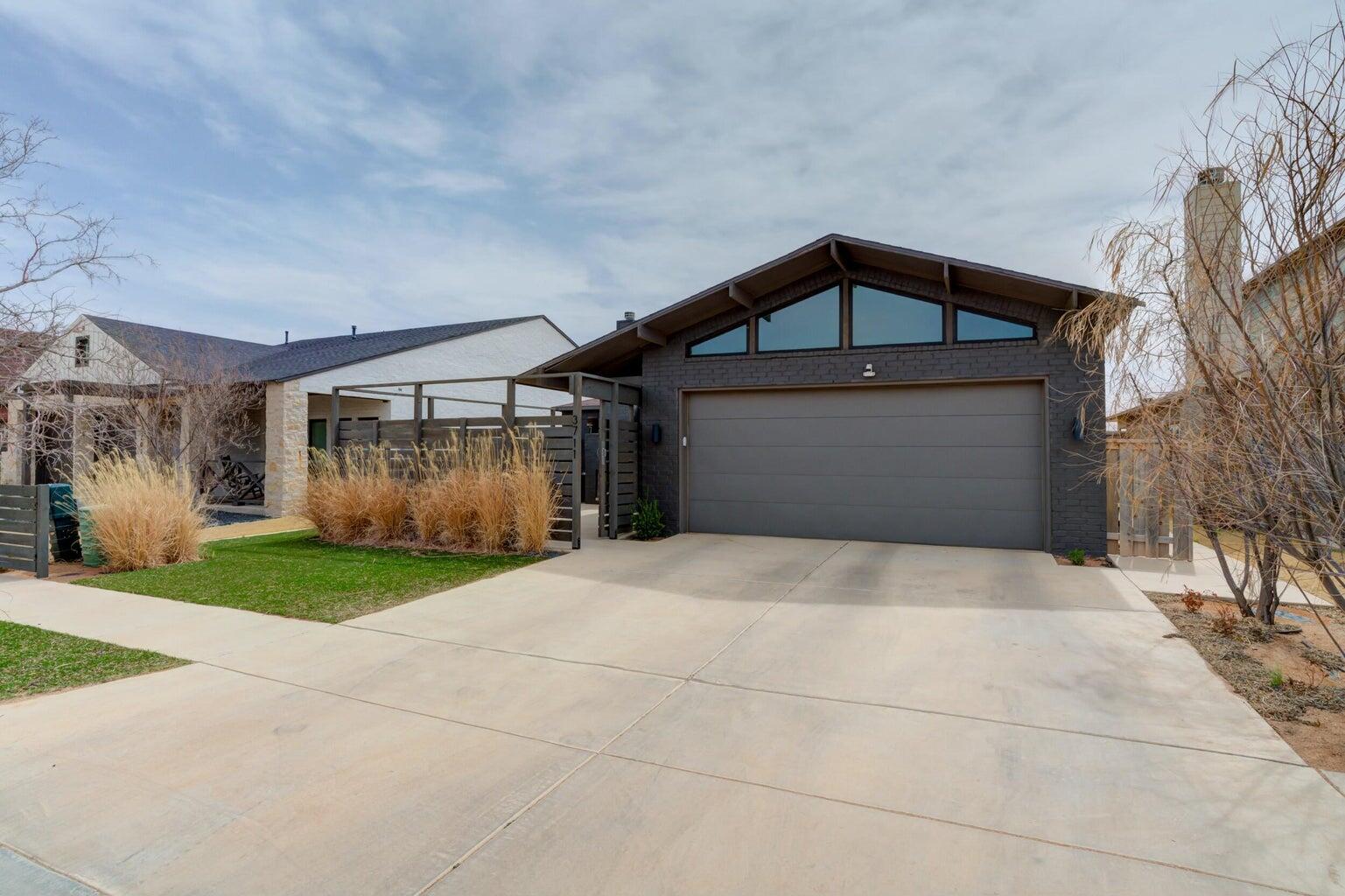 3711 128th Street Lubbock, TX 79423 - Photo 2 of 42 a front view of a house with garden