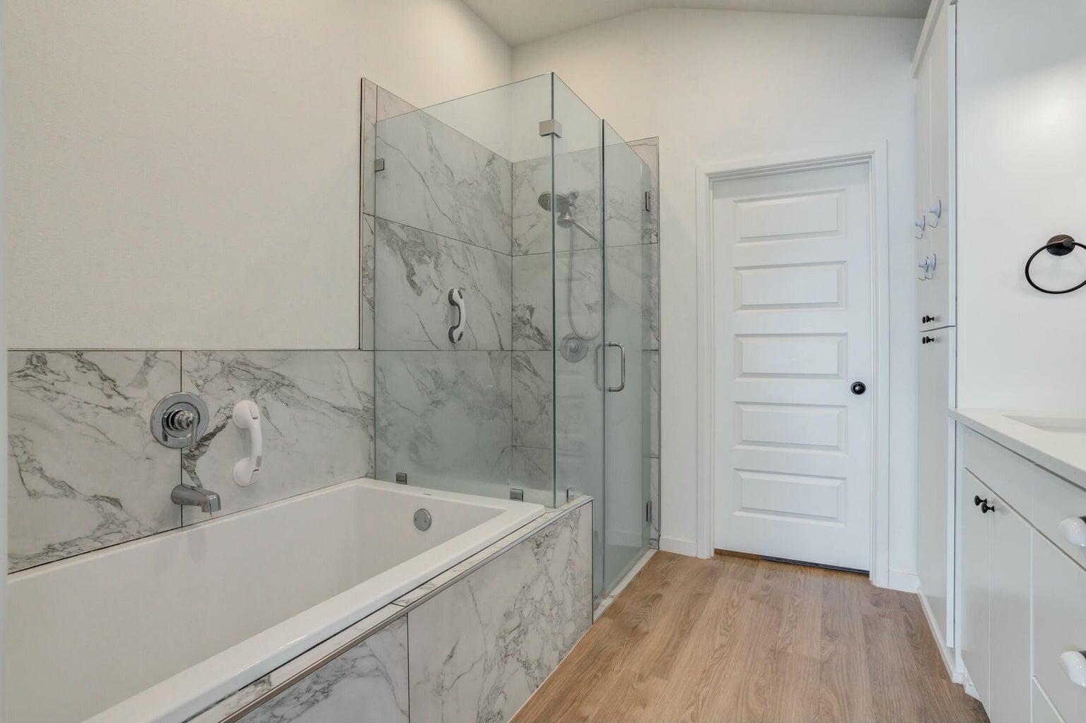 3711 128th Street Lubbock, TX 79423 - Photo 23 of 42 a bathroom with a bathtub and shower