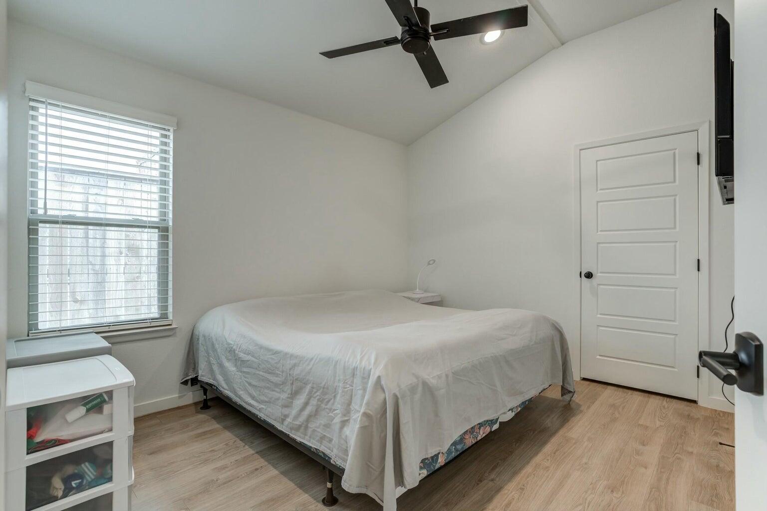 3711 128th Street Lubbock, TX 79423 - Photo 30 of 42 a bedroom with a bed and a window