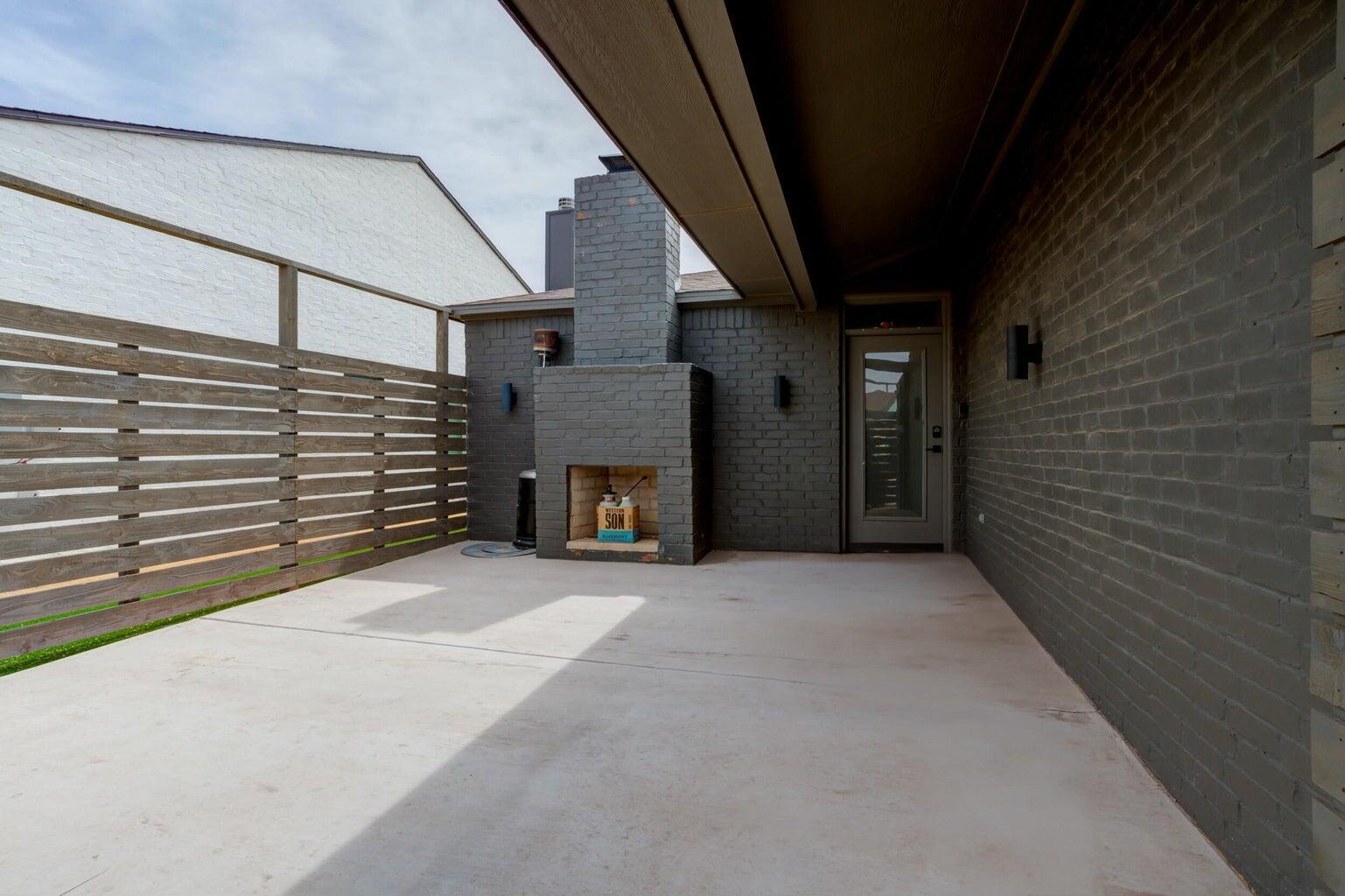 3711 128th Street Lubbock, TX 79423 - Photo 3 of 42 a view of an empty room with a fireplace