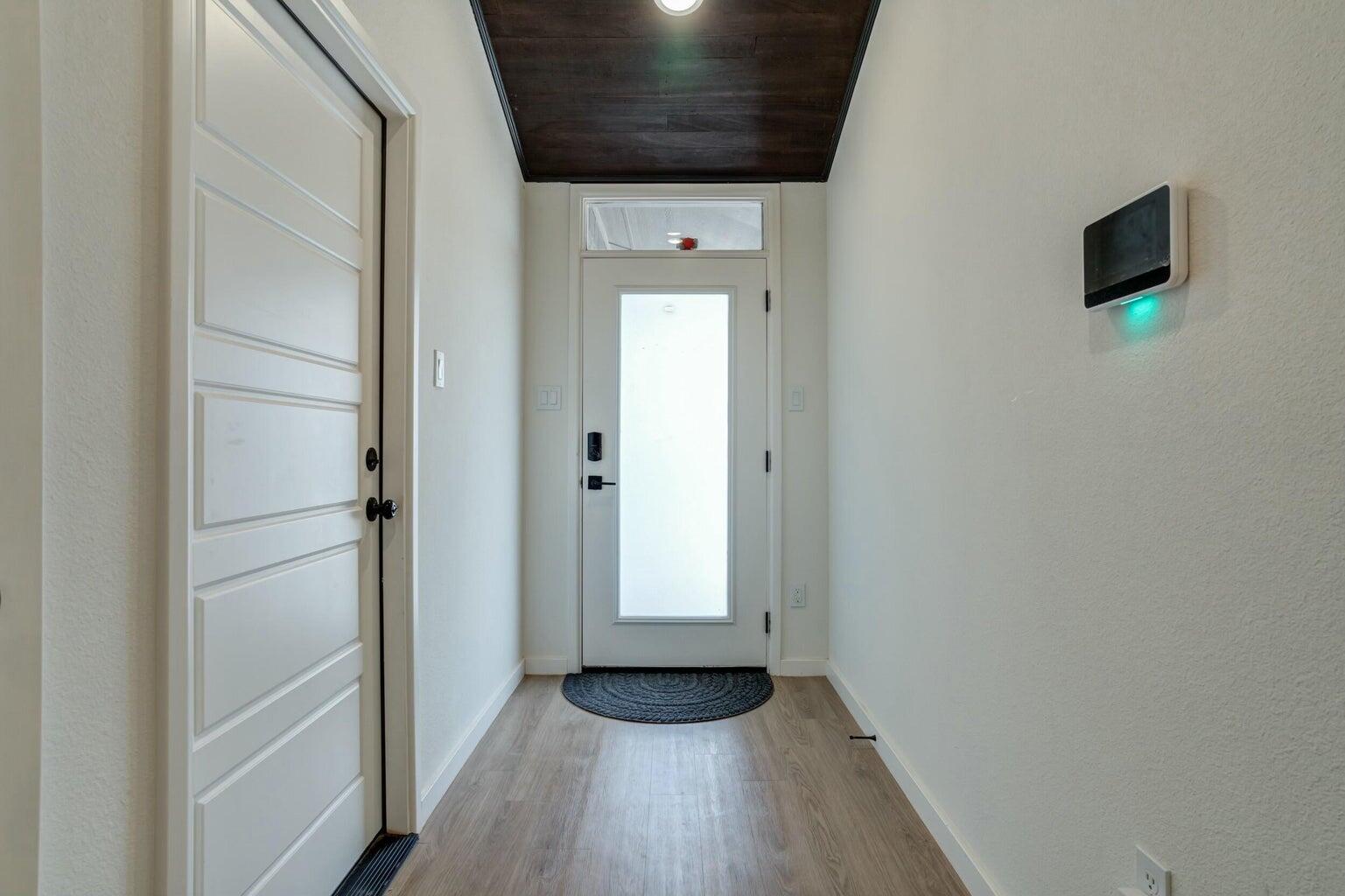 3711 128th Street Lubbock, TX 79423 - Photo 32 of 42 a view of hallway with wooden floor and livingroom