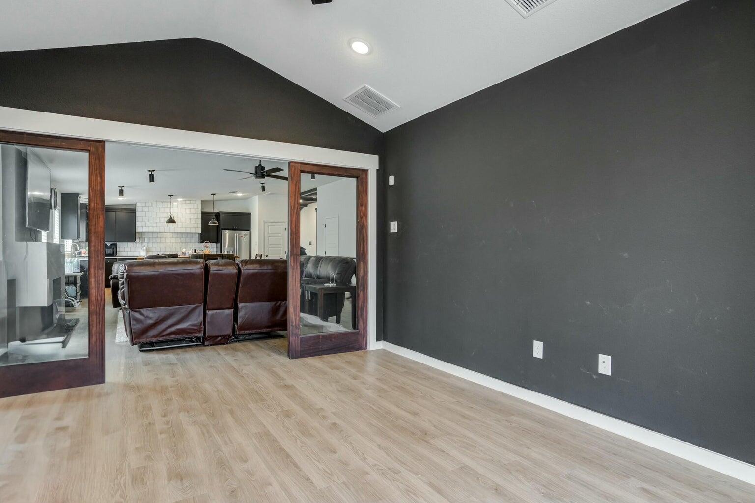 3711 128th Street Lubbock, TX 79423 - Photo 34 of 42 a room with furniture and a flat screen tv