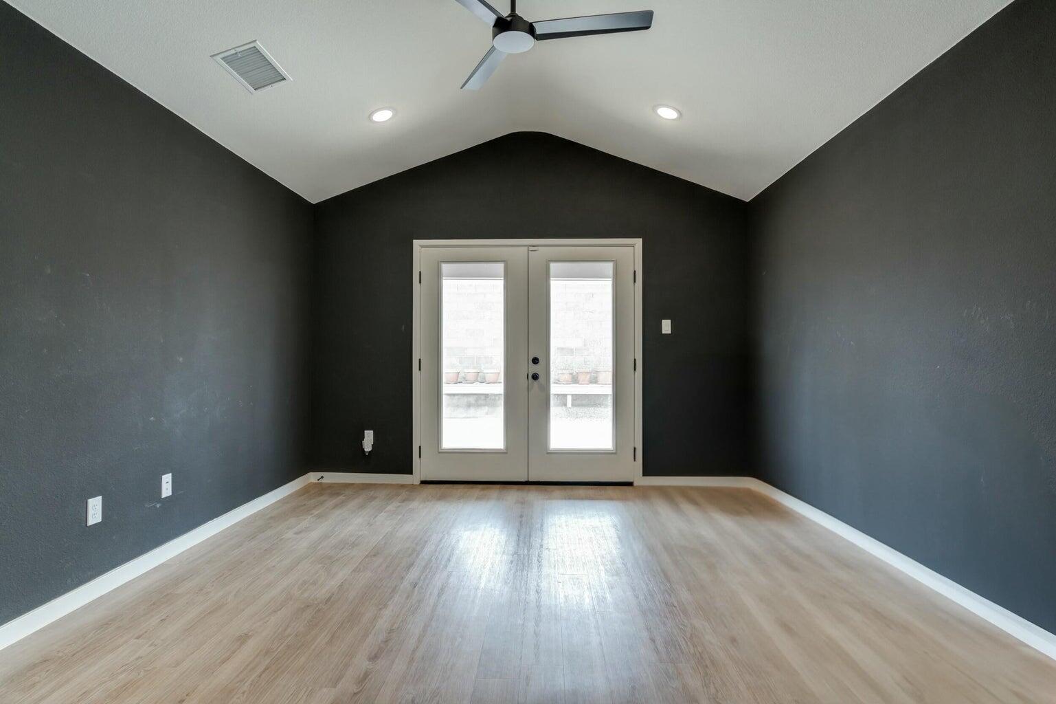 3711 128th Street Lubbock, TX 79423 - Photo 35 of 42 an empty room with wooden floor and windows