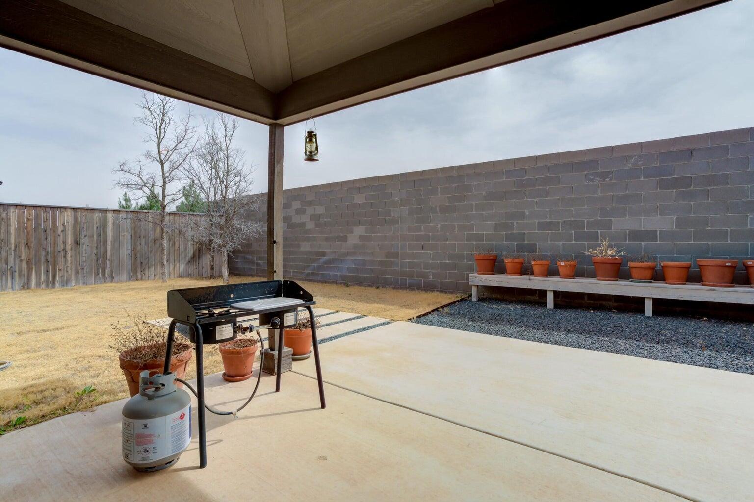 3711 128th Street Lubbock, TX 79423 - Photo 36 of 42 a backyard of a house with outdoor seating