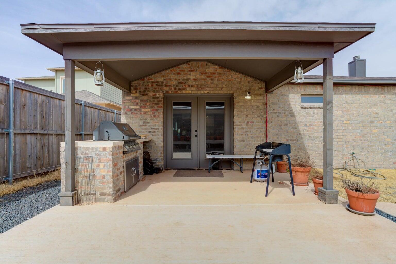 3711 128th Street Lubbock, TX 79423 - Photo 37 of 42 a view of a porch with furniture and a yard