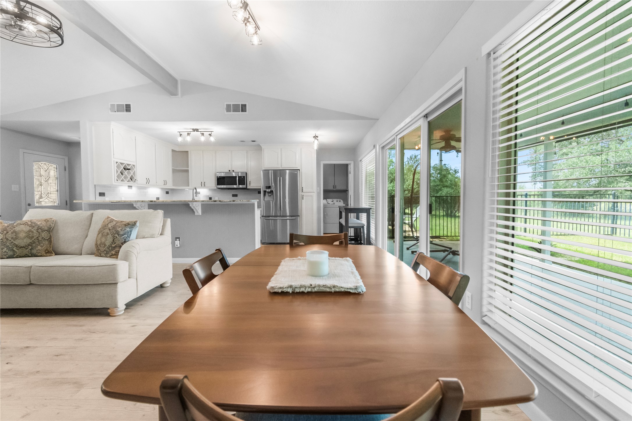 210 Teeoff, Unit B Horseshoe Bay, TX 78657 - Photo 15 of 38 This airy open-concept living space features vaulted ceilings and light flooring throughout.