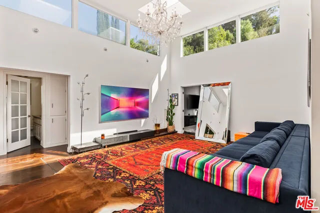 a bathroom with a granite countertop sink a toilet and a mirror