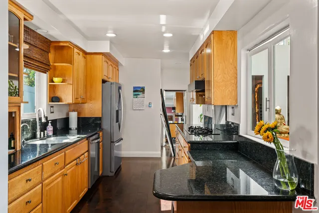 a room with furniture a flat screen tv and a fireplace