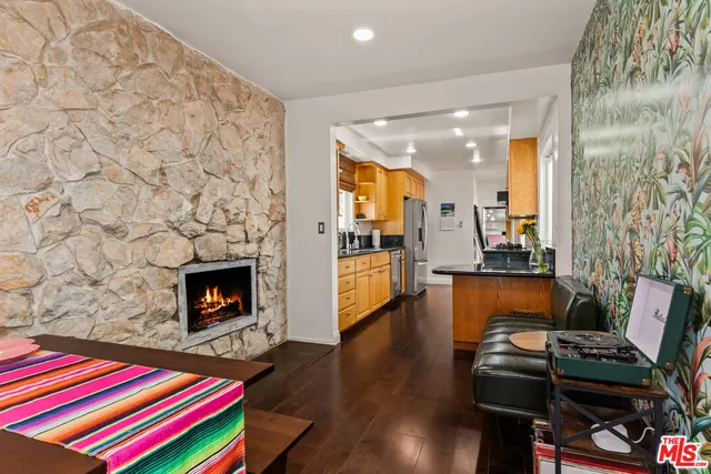 a view of a chairs and table under an umbrella