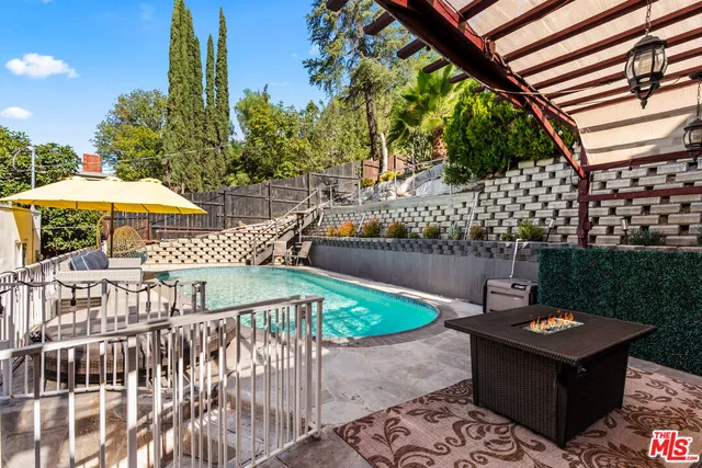a view of a swimming pool with an outdoor seating