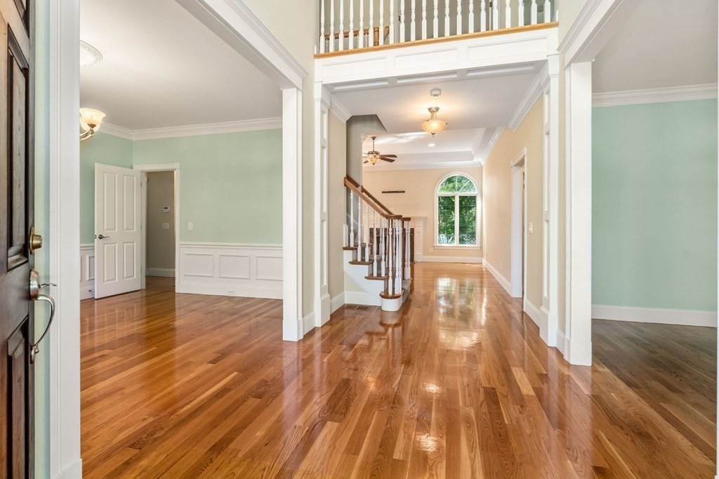 3 Bryn Mawr Road Wellesley, MA 02482 - Photo 13 of 38 a view of a hallway view with wooden floor and staircase