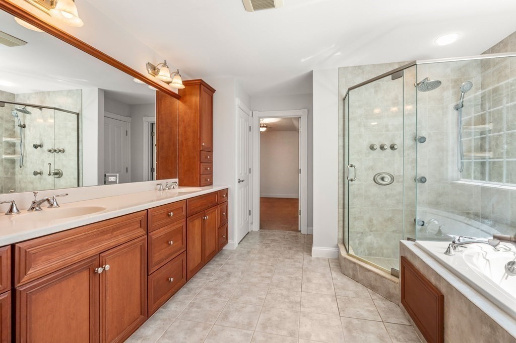 3 Bryn Mawr Road Wellesley, MA 02482 - Photo 16 of 38 a spacious bathroom with a shower sink double vanity and a mirror
