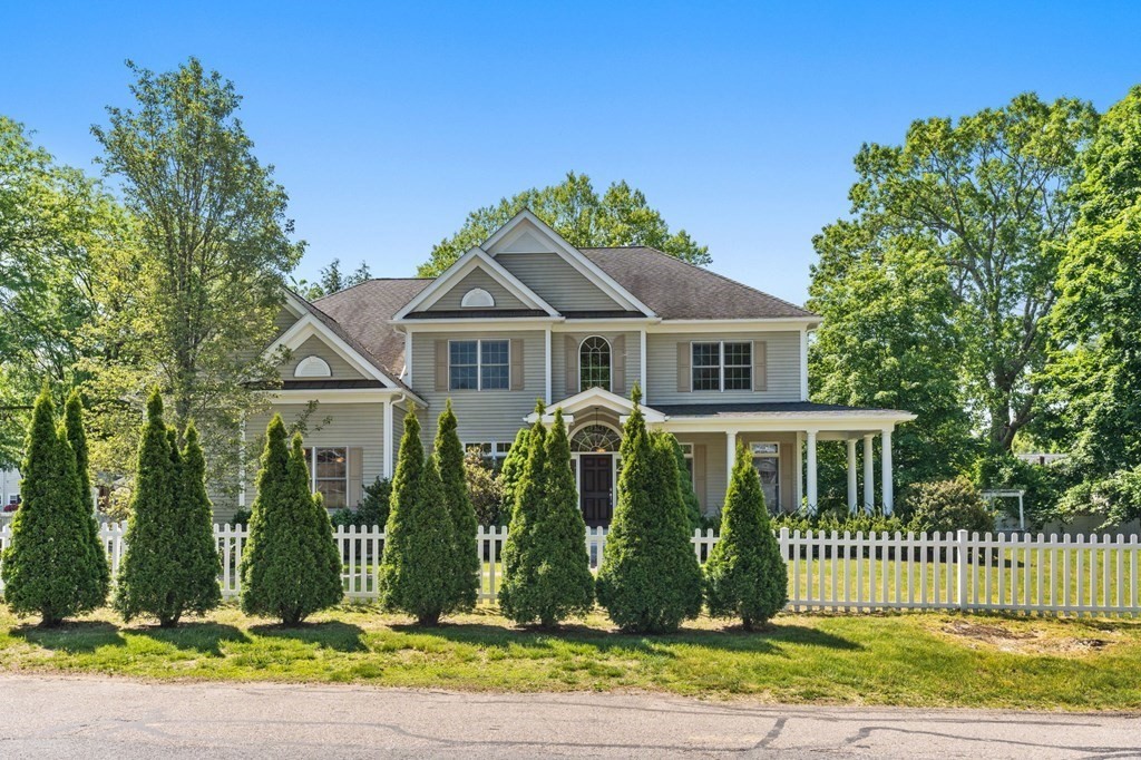 3 Bryn Mawr Road Wellesley, MA 02482 - Photo 2 of 38 a front view of a house with a garden