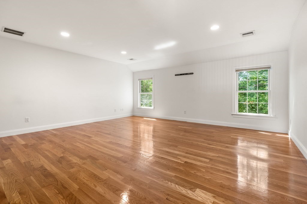 3 Bryn Mawr Road Wellesley, MA 02482 - Photo 24 of 38 an empty room with wooden floor and windows