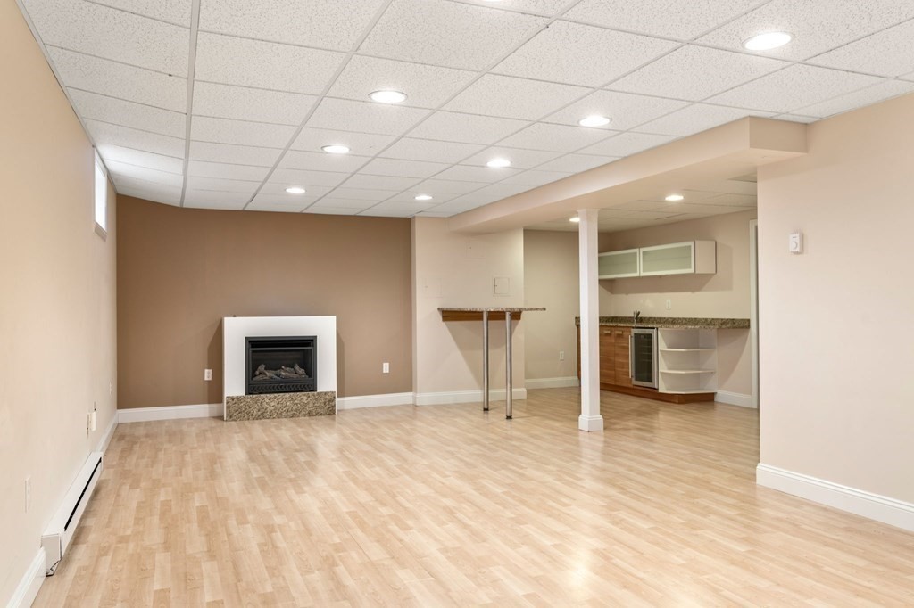 3 Bryn Mawr Road Wellesley, MA 02482 - Photo 27 of 38 a view of an empty room with a kitchen