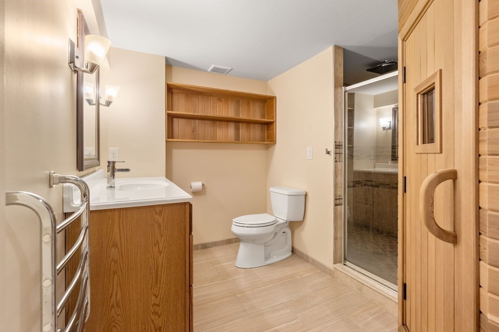 3 Bryn Mawr Road Wellesley, MA 02482 - Photo 28 of 38 a bathroom with a granite countertop sink toilet and shower