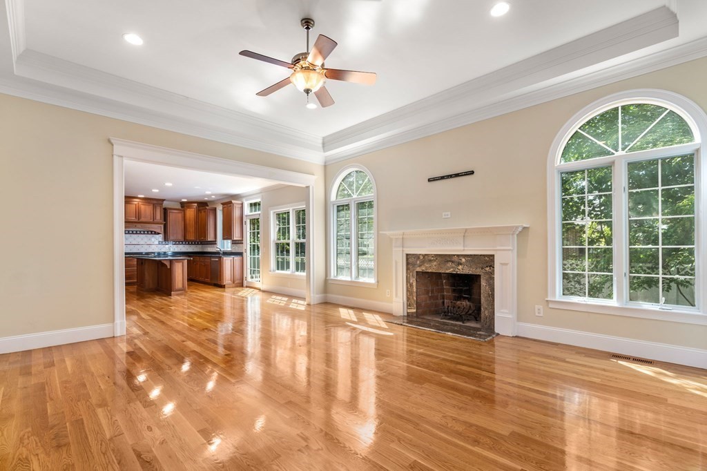 3 Bryn Mawr Road Wellesley, MA 02482 - Photo 3 of 38 a view of an empty room with a fireplace and a window