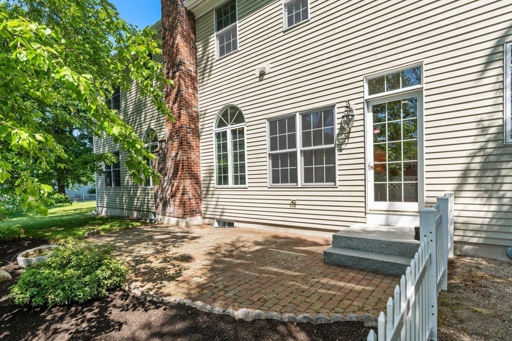 3 Bryn Mawr Road Wellesley, MA 02482 - Photo 31 of 38 a front view of a house with a yard
