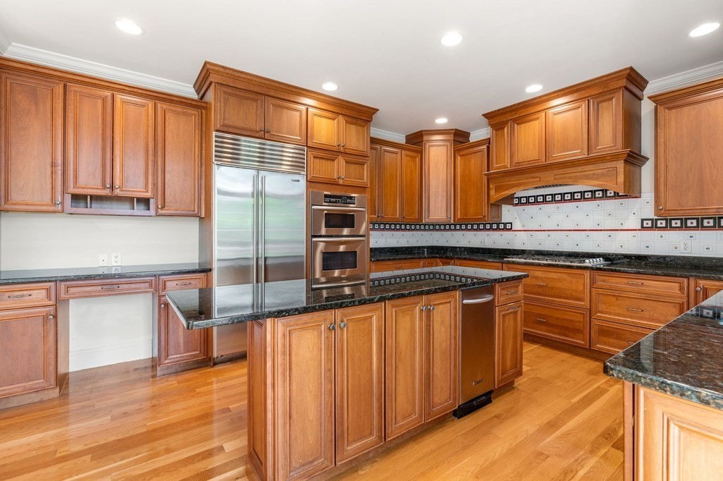 3 Bryn Mawr Road Wellesley, MA 02482 - Photo 5 of 38 a kitchen with stainless steel appliances granite countertop a stove a sink and a microwave
