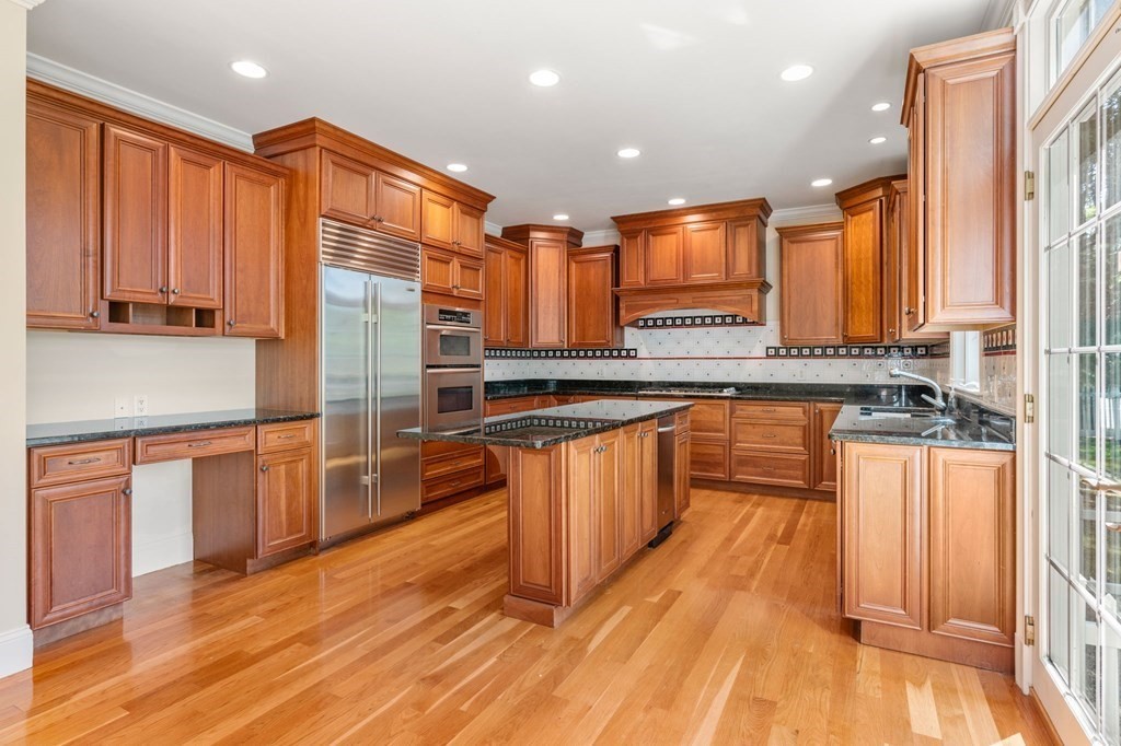 3 Bryn Mawr Road Wellesley, MA 02482 - Photo 7 of 38 a large kitchen with stainless steel appliances granite countertop a stove a sink and a refrigerator
