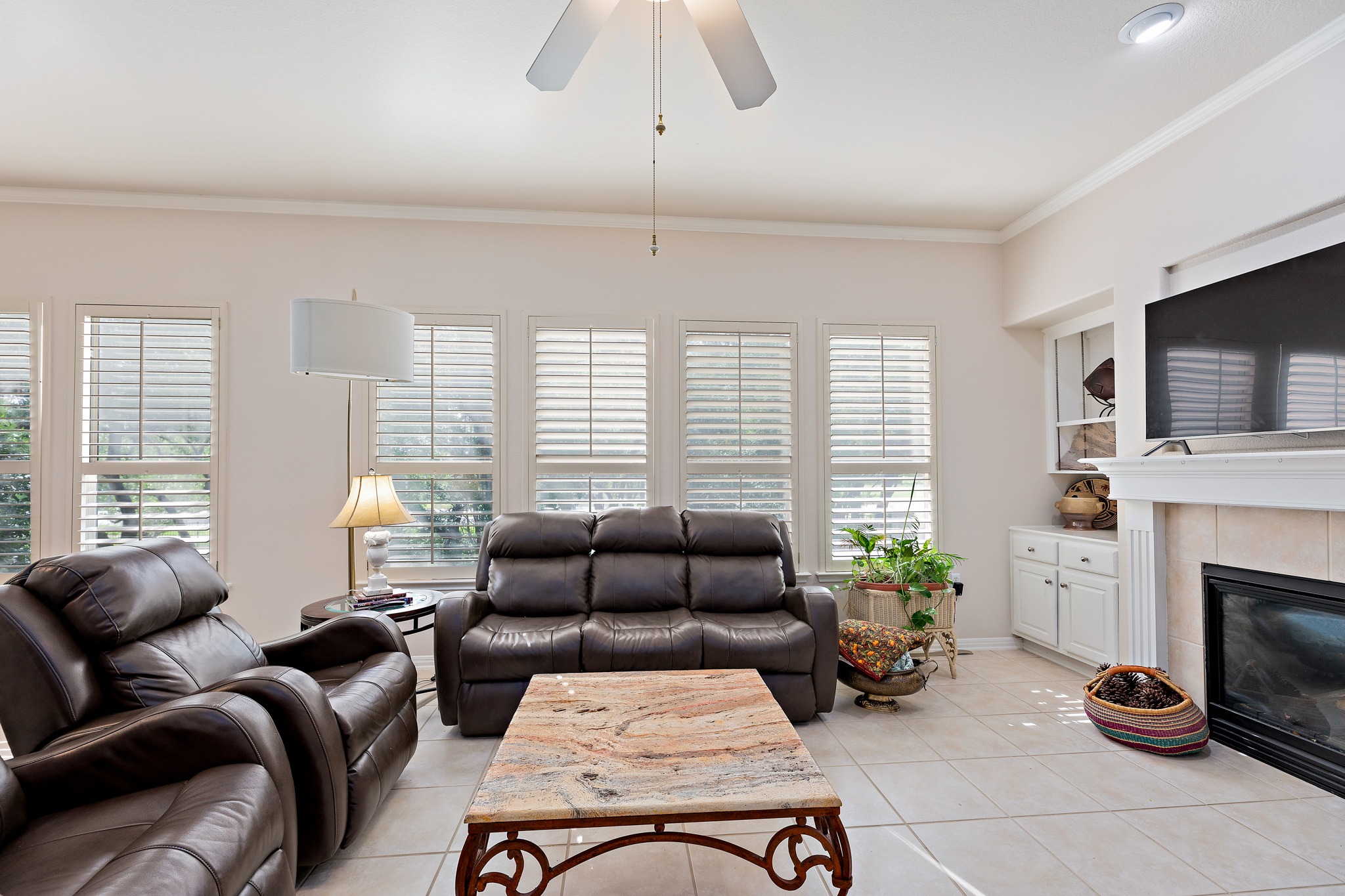 106 Wild Turkey Lane Georgetown, TX 78633 - Photo 17 of 39 a living room with furniture a flat screen tv and a fireplace