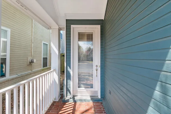 a view of a porch with wooden floor