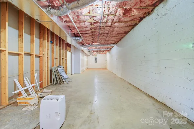 a front view of a house with yard patio and green space